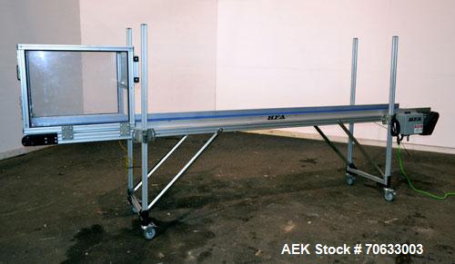 Used HFA Harvard Factory Automation Belt Conveyor.  18" Wide x 156" long belt. Driven by a 1/6 hp, 1/60/115 volt gear motor, ratio 106 to 1, output 82 rpm. Mounted on a manually adjustable height alu...