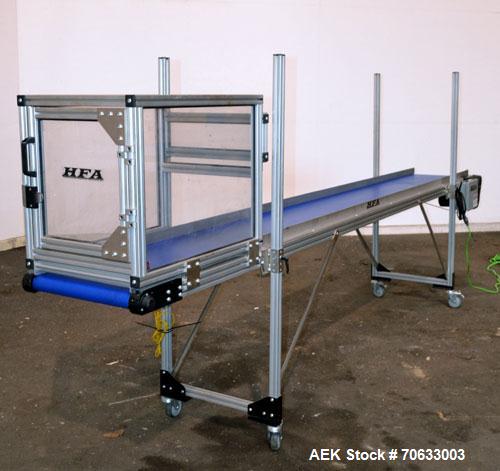 Used HFA Harvard Factory Automation Belt Conveyor.  18" Wide x 156" long belt. Driven by a 1/6 hp, 1/60/115 volt gear motor, ratio 106 to 1, output 82 rpm. Mounted on a manually adjustable height alu...