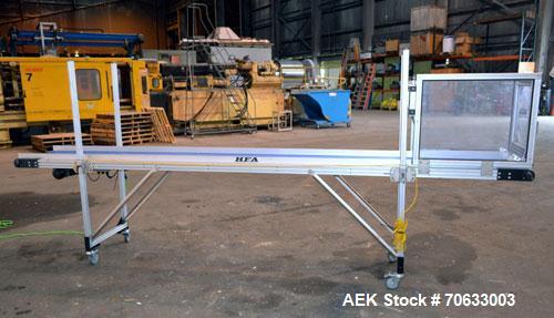 Used HFA Harvard Factory Automation Belt Conveyor.  18" Wide x 156" long belt. Driven by a 1/6 hp, 1/60/115 volt gear motor, ratio 106 to 1, output 82 rpm. Mounted on a manually adjustable height alu...