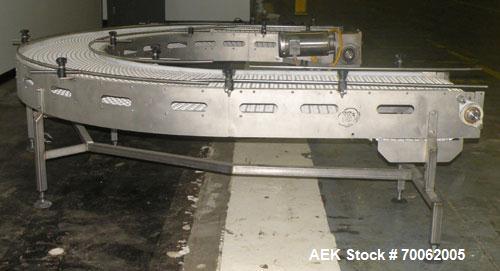 Used SSI 180 Degree U Shaped Belt Conveyor. 17-1/2" wide x 198" long plastic belt. Driven by a Baldor stainless steel washdown motor, 1-1/2 hp, 3/60/208- 230/460 volt, 1740 rpm motor thru a reducer, ...