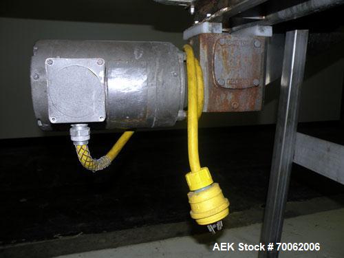 Used Belt Conveyor. 12" wide x 188" long rubber belt. Driven by a 1 HP, 3/60/208- 230/460 Volt, 1725 RPM gear motor, no ratio. 40’’ discharge height. Mounted on a 304 stainless steel frame with legs....