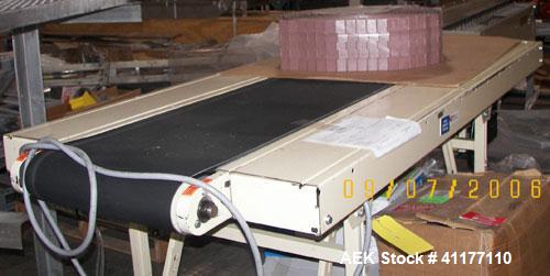 Used Versaveyor Pack Off Belt Conveyor. 18" wide belt. 120" long conveyor with 12" wide pack off tables. 1/2 hp, 1/60/120V, variable speed from 15 to 60 FPM.