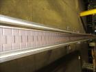 Used American Conveyor stainless steel conveyor system includes (2) Leeson drive motors, (2) 90 degree radius turn sections, and (3) straight runs -SUBJECT TO ENTIRETY BID