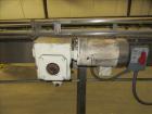 Used American Conveyor stainless steel conveyor system includes (2) Leeson drive motors, (2) 90 degree radius turn sections, and (3) straight runs -SUBJECT TO ENTIRETY BID