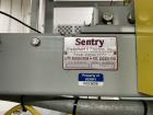 Used Sentry Bottle/cannister Lowerator. Serial Number 1687. Last used with Sentry double high bulk depalletizer with slip sheet dispenser on powdered drink products. Unit is currently installed.