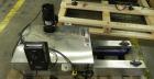 Used Garvey Model 1550 Side Belt Transfer Conveyor. Has Motor Master 20000 variable speed drive. Machine is of stainless steel construction. Has spare conveyor head. 1/3/110V.