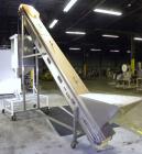 Used Kamflex Inclined Belt Conveyor, Model 705. 12’’ Wide x approximately 180’’ long rubber cleated belt. 6’’ Long pockets with 3’’ tall cleats. End feed hopper. Driven by an approximate 1/2 hp, 1/60...