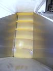 Used Kamflex Inclined Belt Conveyor, Model 705. 12’’ Wide x approximately 180’’ long rubber cleated belt. 6’’ Long pockets with 3’’ tall cleats. End feed hopper. Driven by an approximate 1/2 hp, 1/60...