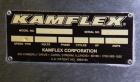 Used Kamflex Inclined Belt Conveyor, Model 705. 12’’ Wide x approximately 180’’ long rubber cleated belt. 6’’ Long pockets with 3’’ tall cleats. End feed hopper. Driven by an approximate 1/2 hp, 1/60...