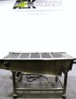 Used Wire Mesh Cooling Conveyor, 304 Stainless Steel. 22'' wide x 60'' long. Driven by a 1/2 hp, 90 volt, 1750 rpm DC gear motor, ratio 43 to 1. Includes a Bronco DC speed controller. 36'' high belt ...