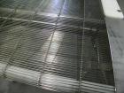 Used Wire Mesh Cooling Conveyor, 304 Stainless Steel. 22'' wide x 60'' long. Driven by a 1/2 hp, 90 volt, 1750 rpm DC gear motor, ratio 43 to 1. Includes a Bronco DC speed controller. 36'' high belt ...