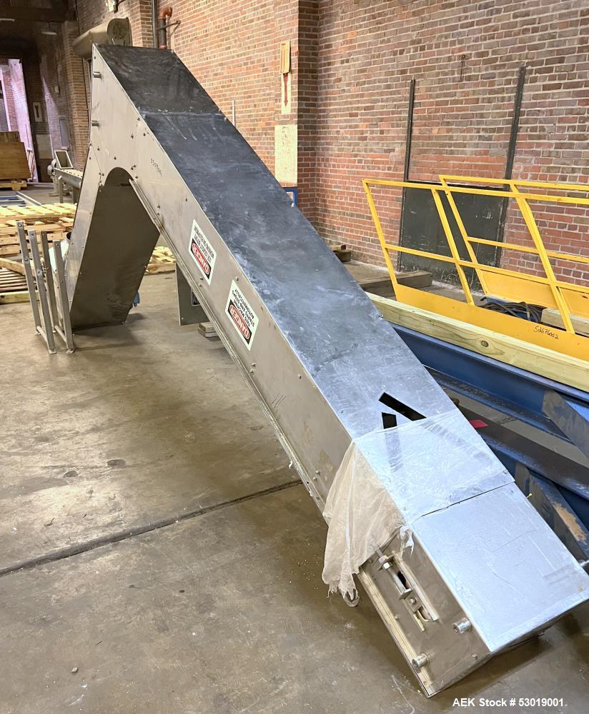 Used- PSG-Dallas Z-Inclined Conveyor. Stainless steel outer, with Plastic Belt. Approximate 15-1/4" wide, cleat 14" wide x 3...