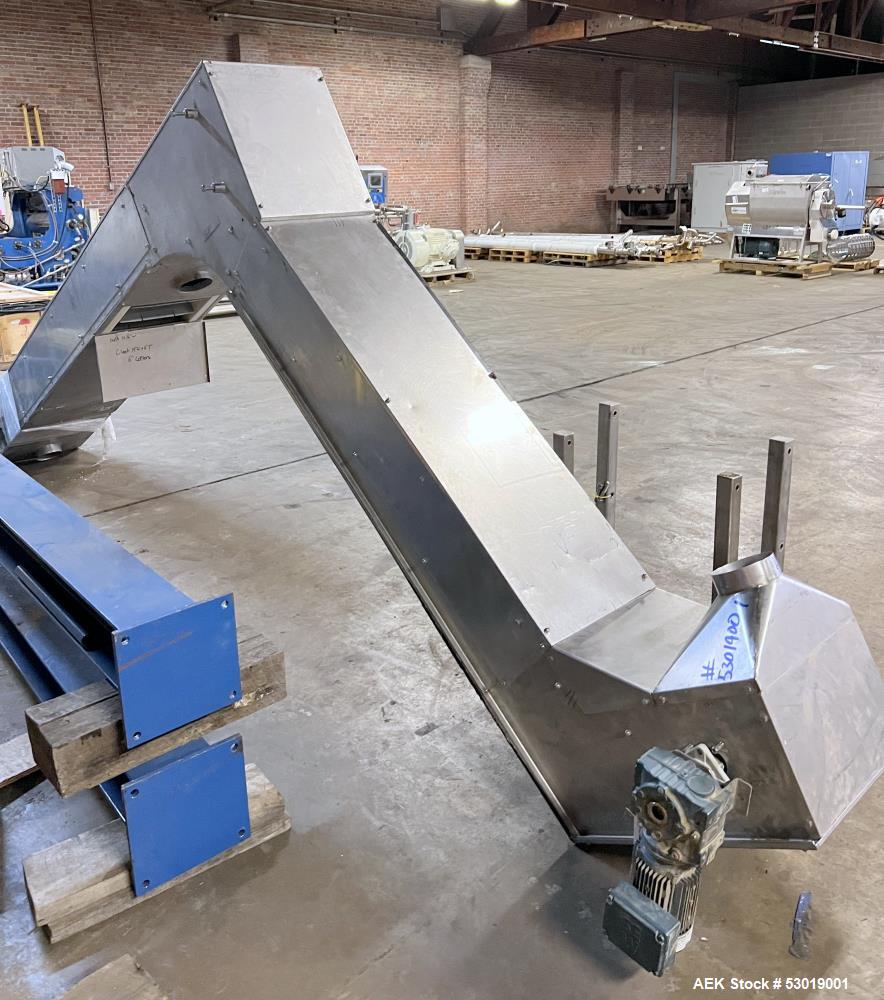 Used- PSG-Dallas Z-Inclined Conveyor. Stainless steel outer, with Plastic Belt. Approximate 15-1/4" wide, cleat 14" wide x 3...