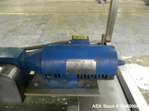 Used Hoppmann Cap Elevator, Stainless Steel. 5” wide x 102” long rubber belt, approximate 108” discharge height. Hopper approximate 46” x 38” x 28” deep. Hinged plexiglass top cover. Driven by a 1/4h...