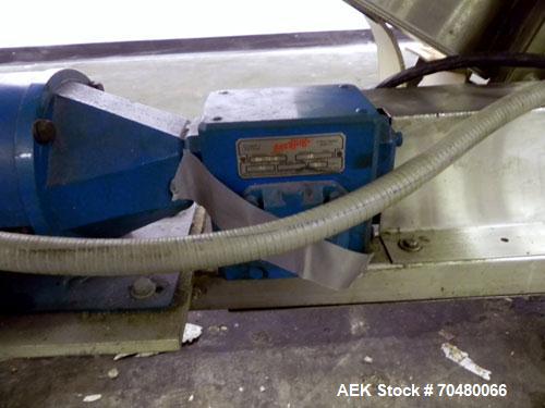 Used Hoppmann Cap Elevator, Stainless Steel. 5” wide x 102” long rubber belt, approximate 108” discharge height. Hopper approximate 46” x 38” x 28” deep. Hinged plexiglass top cover. Driven by a 1/4h...
