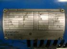 Used Hoppmann Cap Elevator, Stainless Steel. 5” wide x 102” long rubber belt, approximate 108” discharge height. Hopper approximate 46” x 38” x 28” deep. Hinged plexiglass top cover. Driven by a 1/4h...