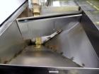 Used Hoppmann Cap Elevator, Stainless Steel. 5” wide x 102” long rubber belt, approximate 108” discharge height. Hopper approximate 46” x 38” x 28” deep. Hinged plexiglass top cover. Driven by a 1/4h...