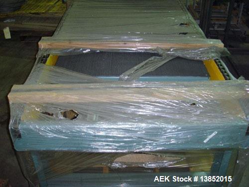 Used Unused-Hytrol pallet conveyor, new in crate. Drag chain conveyor will lift and rotate pallet 90 degrees. 7' OAL x 40-7/8 OAW. Elevation 29" to top of chain.