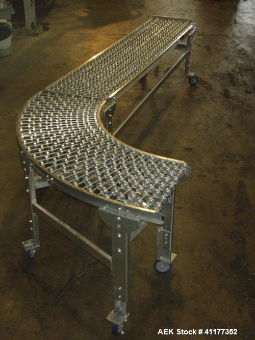 Used- Dead Case Roller Conveyor. 90 degree turn. All stainless steel frame mounted on casters.