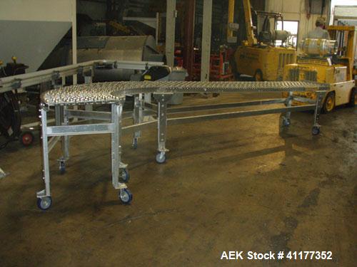 Used- Dead Case Roller Conveyor. 90 degree turn. All stainless steel frame mounted on casters.