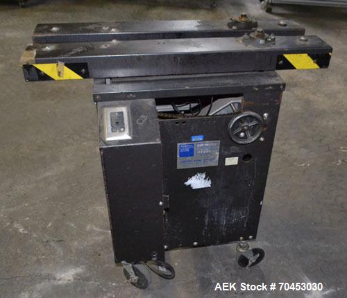 Used Dennison M400 Side Belt Gap Transfer Conveyor. Capable of speeds up to 250 CPM.  Side belt transfer for bottom coding of containers. Container size range: (length) 1" - 7" (width) 1" - 7" (heigh...