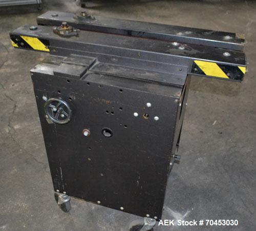 Used Dennison M400 Side Belt Gap Transfer Conveyor. Capable of speeds up to 250 CPM.  Side belt transfer for bottom coding of containers. Container size range: (length) 1" - 7" (width) 1" - 7" (heigh...