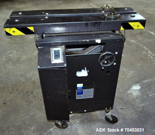Used Dennison M400 Side Belt Gap Transfer Conveyor. Capable of speeds up to 250 CPM.  Side belt transfer for bottom coding of containers. Container size range: (length) 1" - 7" (width) 1" - 7" (heigh...
