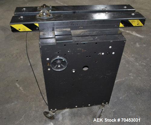 Used Dennison M400 Side Belt Gap Transfer Conveyor. Capable of speeds up to 250 CPM.  Side belt transfer for bottom coding of containers. Container size range: (length) 1" - 7" (width) 1" - 7" (heigh...