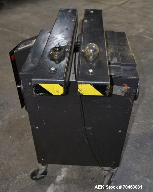Used Dennison M400 Side Belt Gap Transfer Conveyor. Capable of speeds up to 250 CPM.  Side belt transfer for bottom coding of containers. Container size range: (length) 1" - 7" (width) 1" - 7" (heigh...
