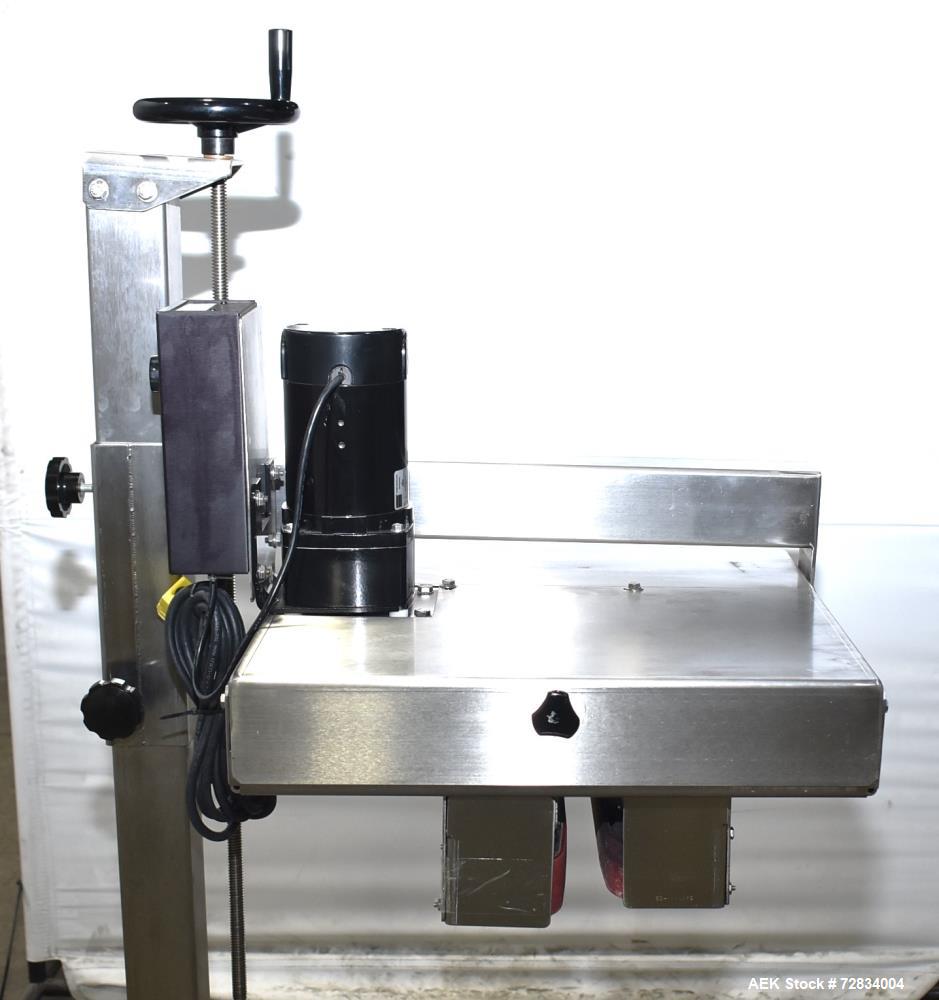 Used Garvey Side Belt Gap Transfer Conveyor. (2) Belts, approximate 39" long x 2" wide. Adjustable height. Mounted on casters. Last used with Video Jet coder for bottom date coding. 1/60/115 Volt.
