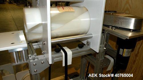 Used Carleton Helical Technologies Carleton Carton Twister. (2) 1/4hp, 90 volt dc motors, (1) Penta drive controller. Designed to gently and rapidly invert or rotate positions a variety of containers...