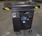 Used Dennison M400 Side Belt Gap Transfer Conveyor. Capable of speeds up to 250 CPM.  Side belt transfer for bottom coding of containers. Container size range: (length) 1