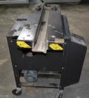 Used Dennison M400 Side Belt Gap Transfer Conveyor. Capable of speeds up to 250 CPM.  Side belt transfer for bottom coding of containers. Container size range: (length) 1