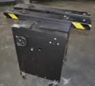Used Dennison M400 Side Belt Gap Transfer Conveyor. Capable of speeds up to 250 CPM.  Side belt transfer for bottom coding of containers. Container size range: (length) 1