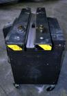 Used Dennison M400 Side Belt Gap Transfer Conveyor. Capable of speeds up to 250 CPM.  Side belt transfer for bottom coding of containers. Container size range: (length) 1