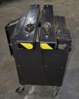 Used Dennison M400 Side Belt Gap Transfer Conveyor. Capable of speeds up to 250 CPM.  Side belt transfer for bottom coding of containers. Container size range: (length) 1