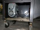 Used Dennison M400 Side Belt Gap Transfer Conveyor. Capable of speeds up to 250 CPM.  Side belt transfer for bottom coding of containers. Container size range: (length) 1