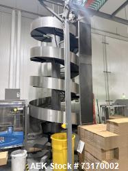 Used- Ambaflex Spiral Case Conveyor, Model Spiralveyor SV. Approximately 9' tall with a 16" belt width. Stainless steel cons...