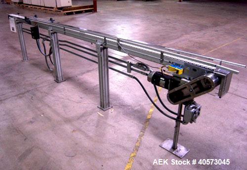 Used Flex Link Conveyor. 3 1/4" wide x 120" long plastic belt. Driven by a 1/3 hp, 90 volt, 1750 rpm DC gearmotor, ratio 20 to 1. Includes a  variable speed controller. Mounted on an aluminum frame w...