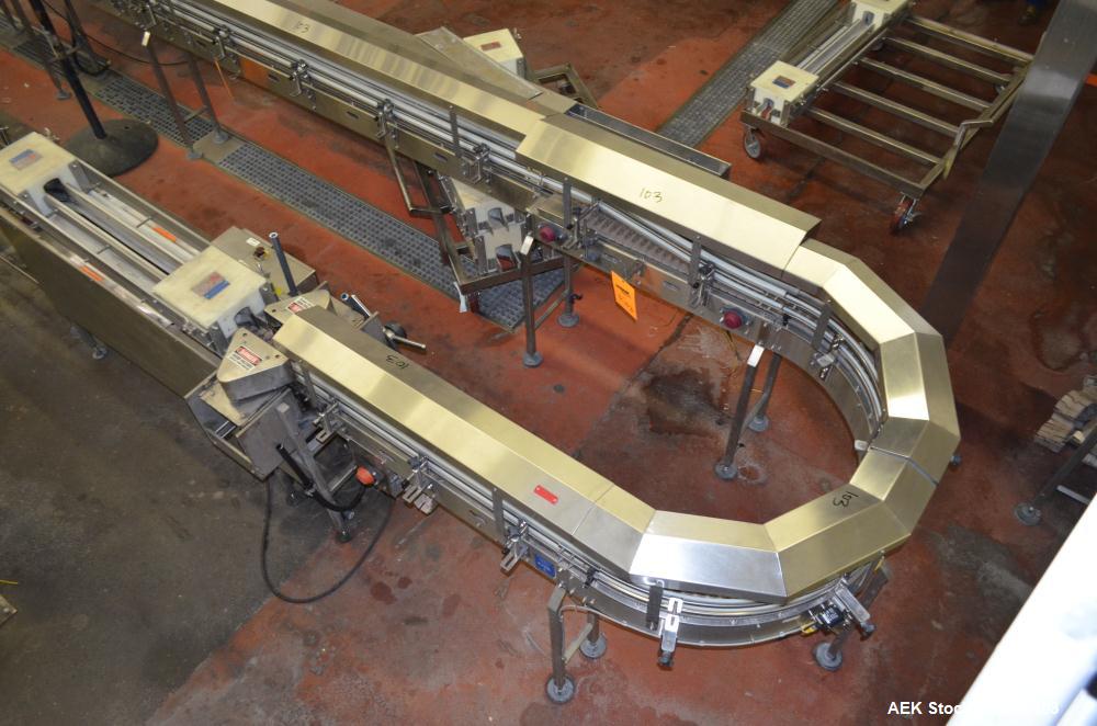 Used Table Top Belt Conveyor. Approximately 4" wide x 1500” long, partial belt.  Stainless steel frame.  Includes (9) turns, (11) gear motors.  (2) Sections of multiple belt accumulation tables.