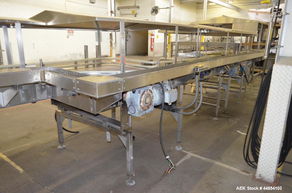 Used Table Top Belt Conveyor. Approximately 4" wide x 1500” long, partial belt.  Stainless steel frame.  Includes (9) turns, (11) gear motors.  (2) Sections of multiple belt accumulation tables.
