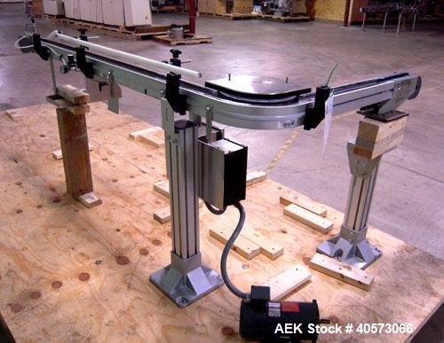 Used Flex Link Conveyor. 3 1/4" wide x 32" long section x 70" long section x 90 degree center turn. Driven by a 3/4 hp, 90 volt, 1725 rpm motor. Includes a Reliance VS drive. Mounted on an aluminum f...