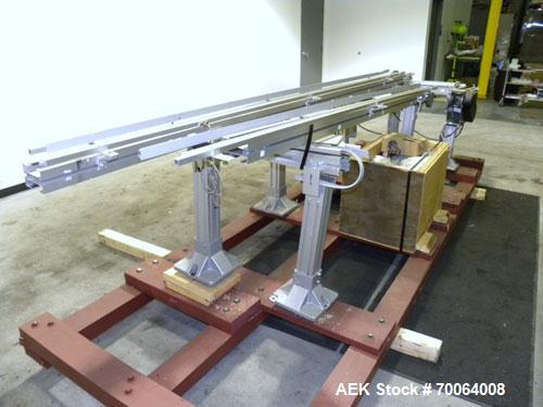 Used Flexlink "U" Shaped Table Top Belt Conveyor. 4" Wide plastic belt. (1) 86" long straight section, (1) 148" long straight section, (1) 144" long U section, (1) 24" long drive section. 1/2 hp, 3/6...