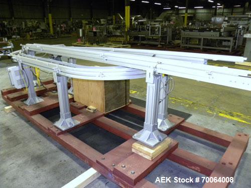 Used Flexlink "U" Shaped Table Top Belt Conveyor. 4" Wide plastic belt. (1) 86" long straight section, (1) 148" long straight section, (1) 144" long U section, (1) 24" long drive section. 1/2 hp, 3/6...