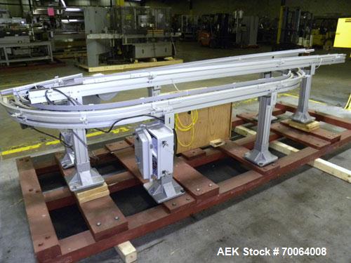 Used Flexlink "U" Shaped Table Top Belt Conveyor. 4" Wide plastic belt. (1) 86" long straight section, (1) 148" long straight section, (1) 144" long U section, (1) 24" long drive section. 1/2 hp, 3/6...