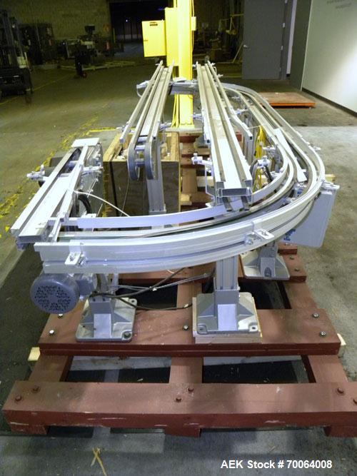 Used Flexlink "U" Shaped Table Top Belt Conveyor. 4" Wide plastic belt. (1) 86" long straight section, (1) 148" long straight section, (1) 144" long U section, (1) 24" long drive section. 1/2 hp, 3/6...