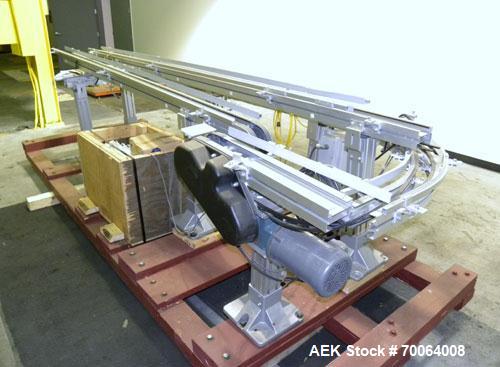 Used Flexlink "U" Shaped Table Top Belt Conveyor. 4" Wide plastic belt. (1) 86" long straight section, (1) 148" long straight section, (1) 144" long U section, (1) 24" long drive section. 1/2 hp, 3/6...