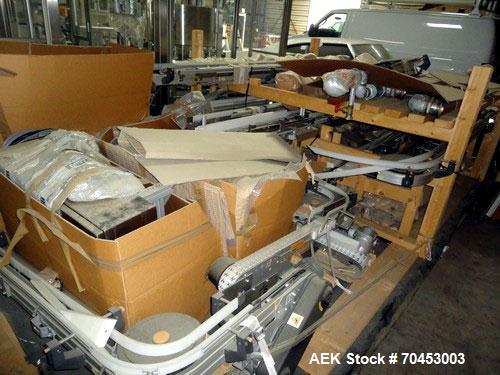 Used Flexible link style Conveyor System, not installed, 2-1/2" wide x approximately 100' long including straight and radius sections, with multiple drives and a control panel on skid.