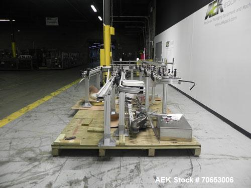 Used Flexlink Model XH (103mm) Industial Flexible Conveyor.. Last handling 3" diameter pharmaceutical grade plastic bottles. 3.25" Flexlink plastic chain, aluminum extruded frames, 6 sections: 45"/90...