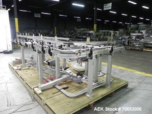 Used Flexlink Model XH (103mm) Industial Flexible Conveyor.. Last handling 3" diameter pharmaceutical grade plastic bottles. 3.25" Flexlink plastic chain, aluminum extruded frames, 6 sections: 45"/90...